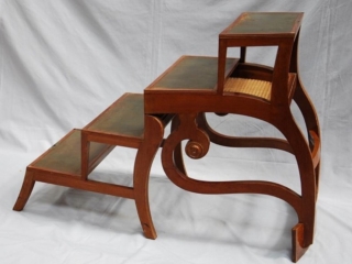 A REGENCY MAHOGANY METAMORPHIC LIBRARY ARMCHAIR