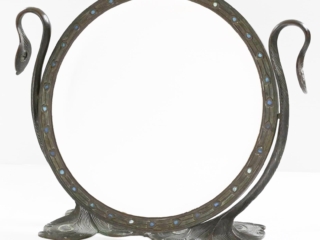 A Tiffany Studios New York glass and bronze Peacock mirror