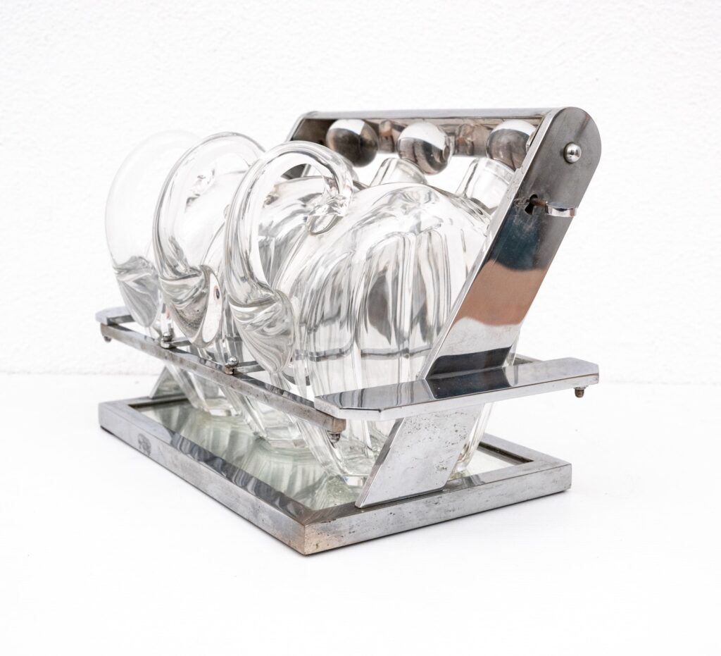 Jacques-Adnet-attributed-tantulus-containing-three-Baccarat-Carafes1