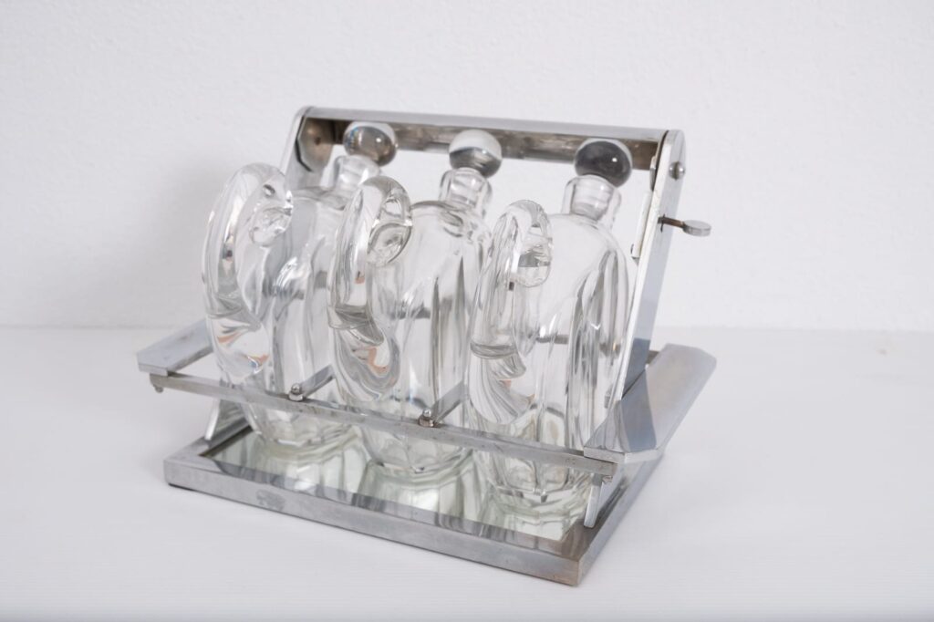 Jacques-Adnet-attributed-tantulus-containing-three-Baccarat-Carafes4