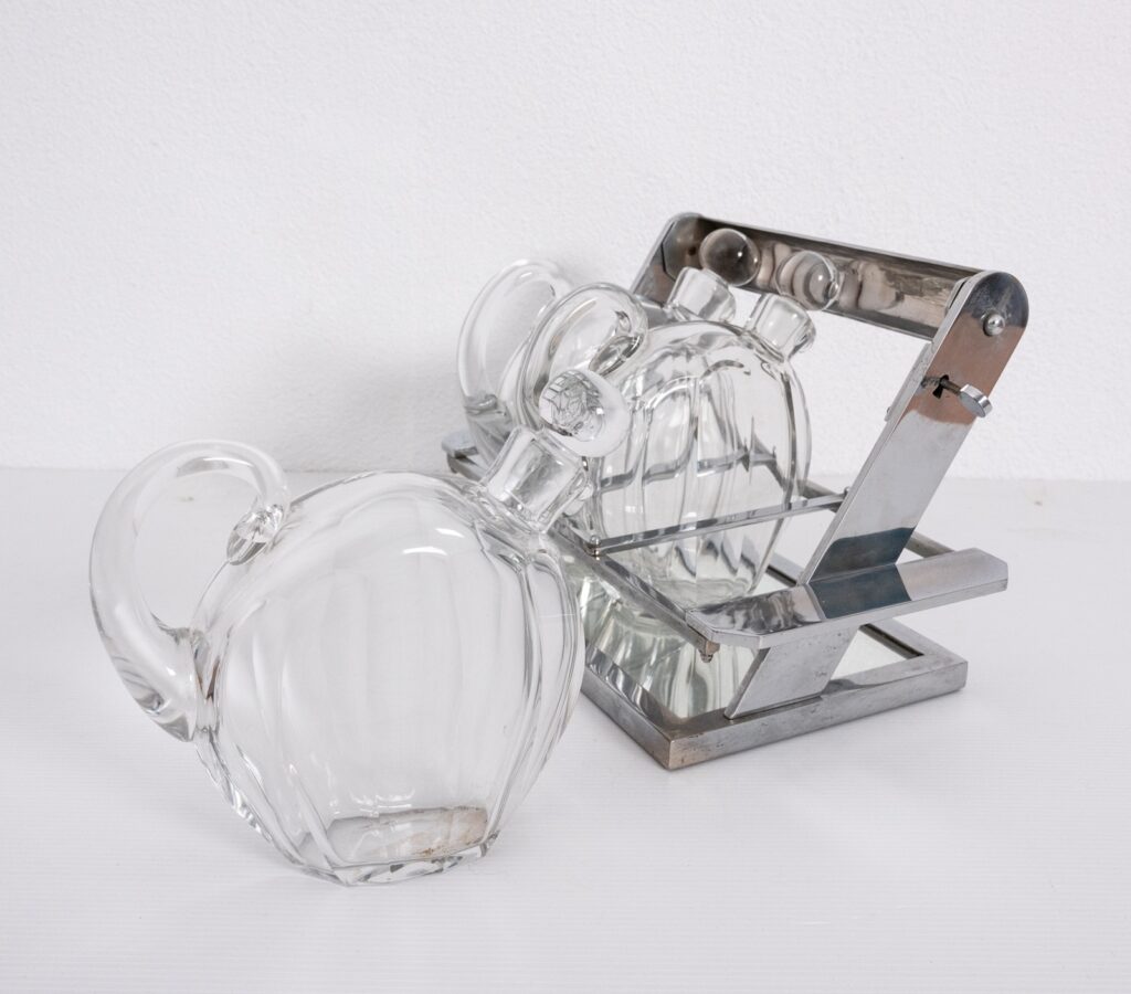 Jacques-Adnet-attributed-tantulus-containing-three-Baccarat-Carafes8